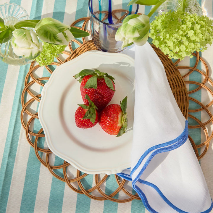Blue edged linen napkin paired with blue and white tableware