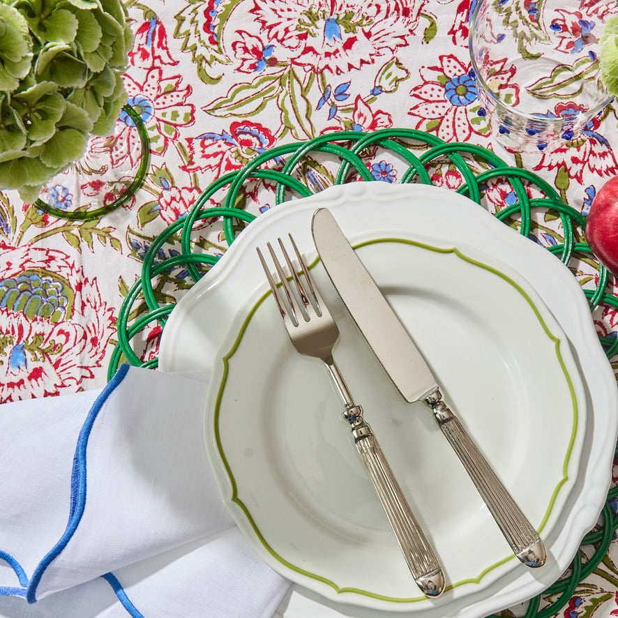 Blue edged linen napkin showing embroidered edge detail