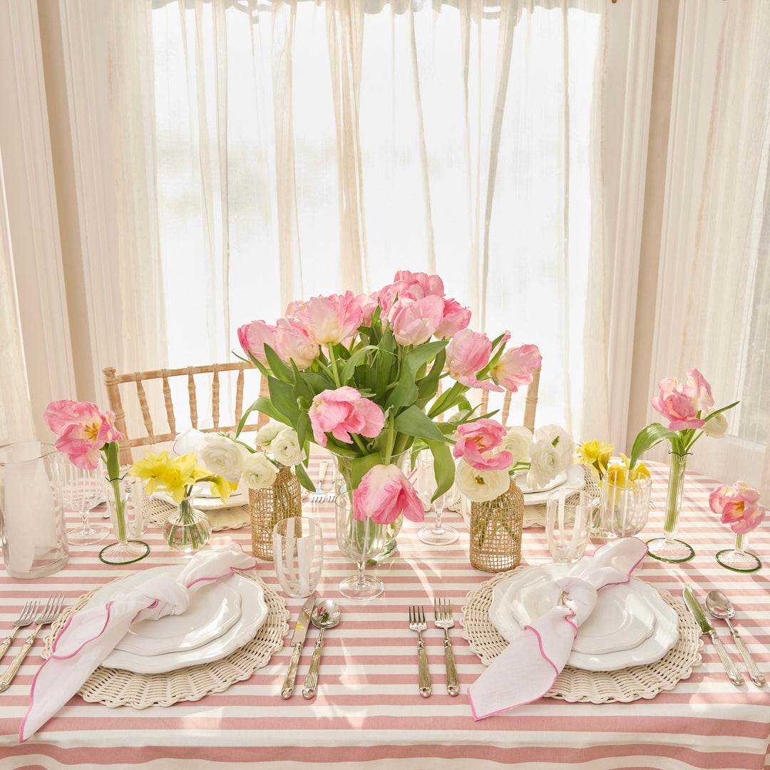 Pink Ava linen napkin folded on a place setting
