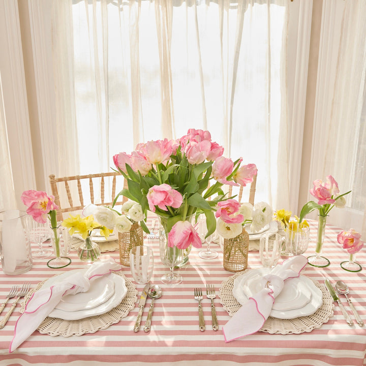 Pink Ava linen napkin folded on a place setting