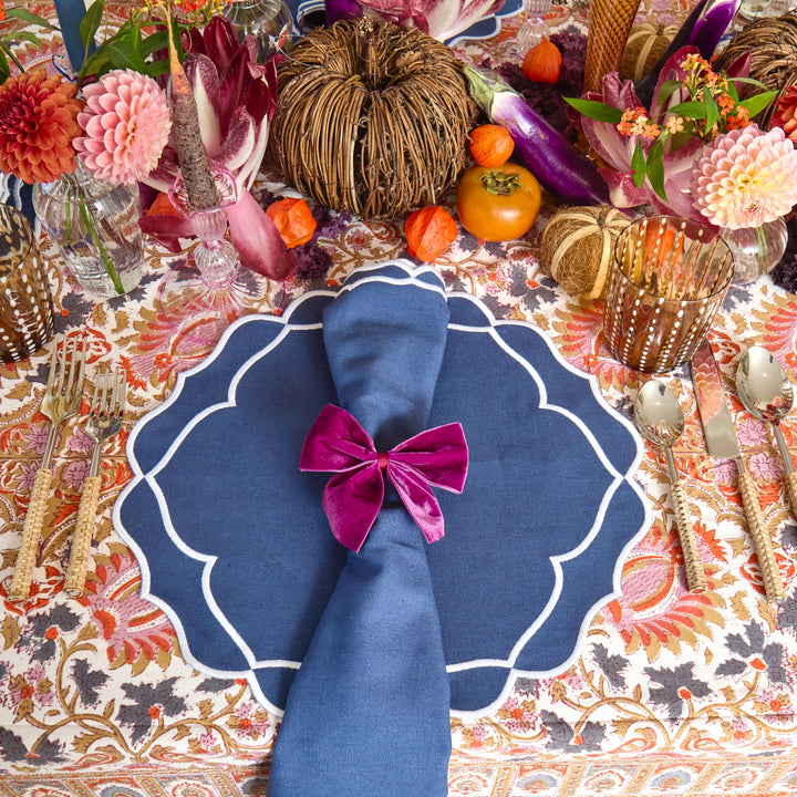 Blue Sasha napkin detail against white tableware
