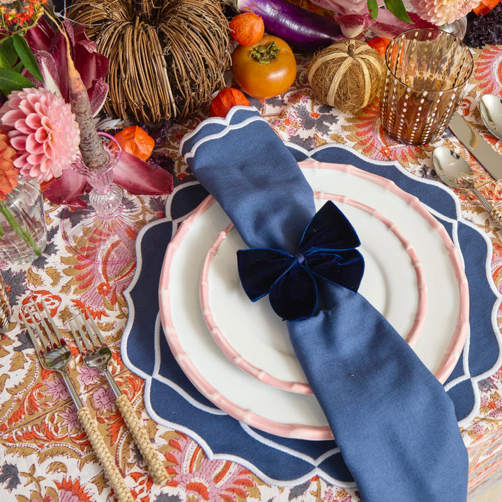 Blue Sasha napkins styled on a dinner table