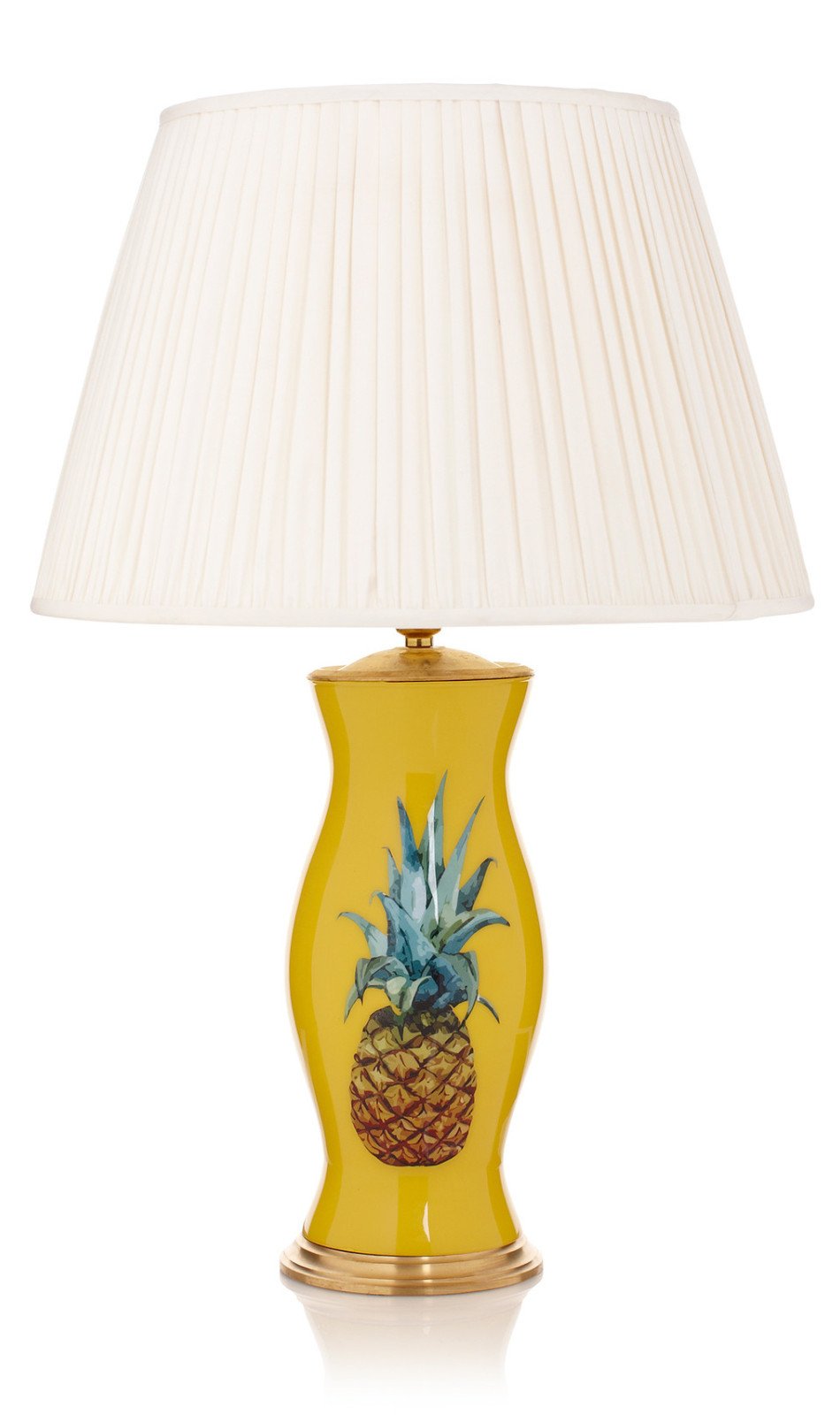 Yellow table lamp with pineapple pattern, adding a tropical touch to any room decor.